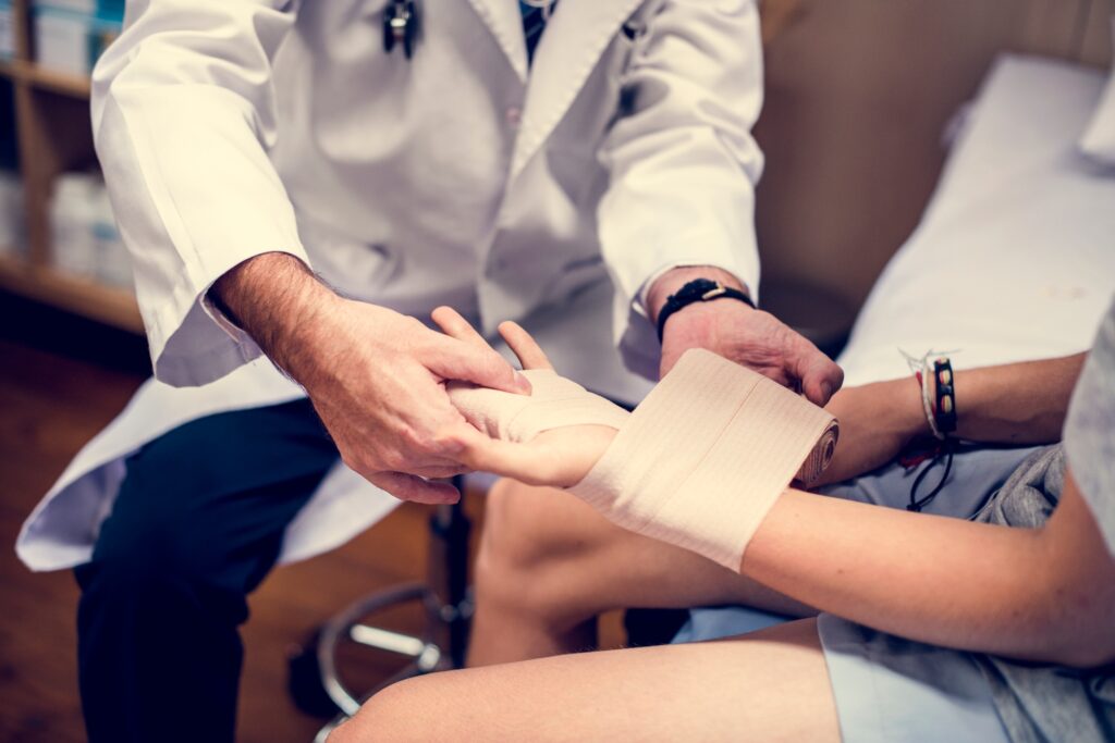 Doctor assisting a patient